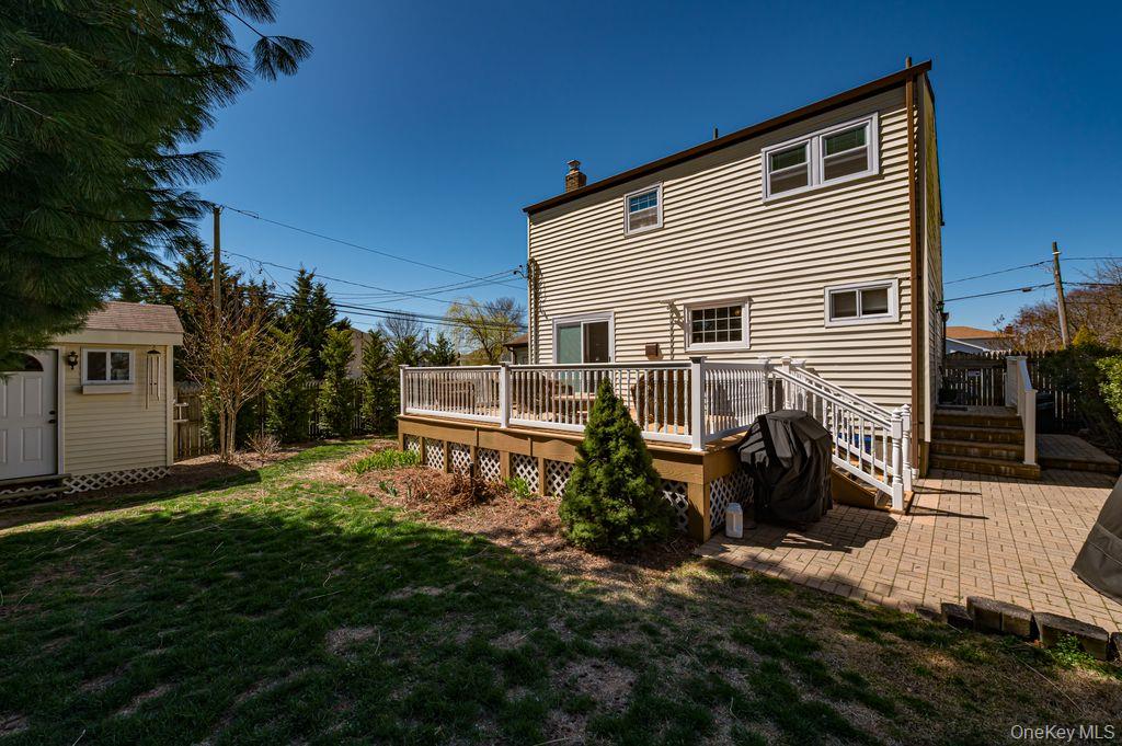 89 Cheltenham Road West Babylon, NY 11704 - Photo 21 of 26 a view of a house with backyard and sitting area