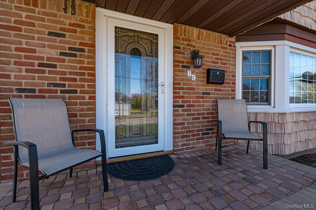 89 Cheltenham Road West Babylon, NY 11704 - Photo 3 of 26 a backyard of a house with seating space