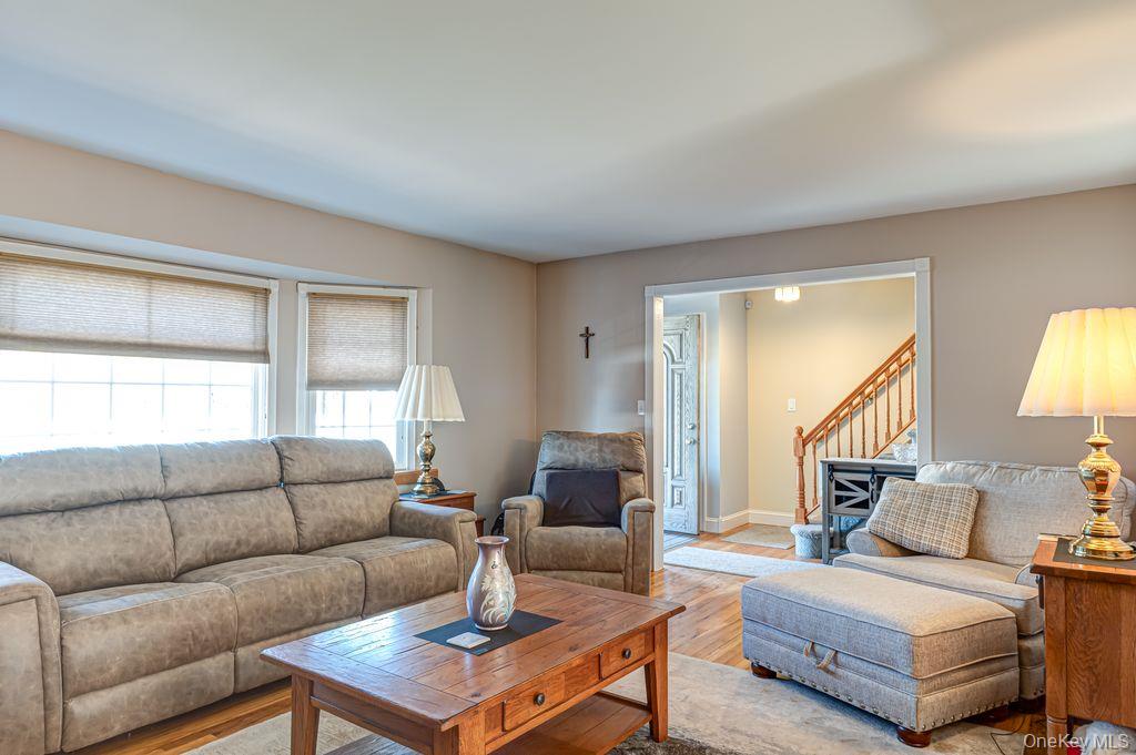 89 Cheltenham Road West Babylon, NY 11704 - Photo 8 of 26 a living room with furniture and a window
