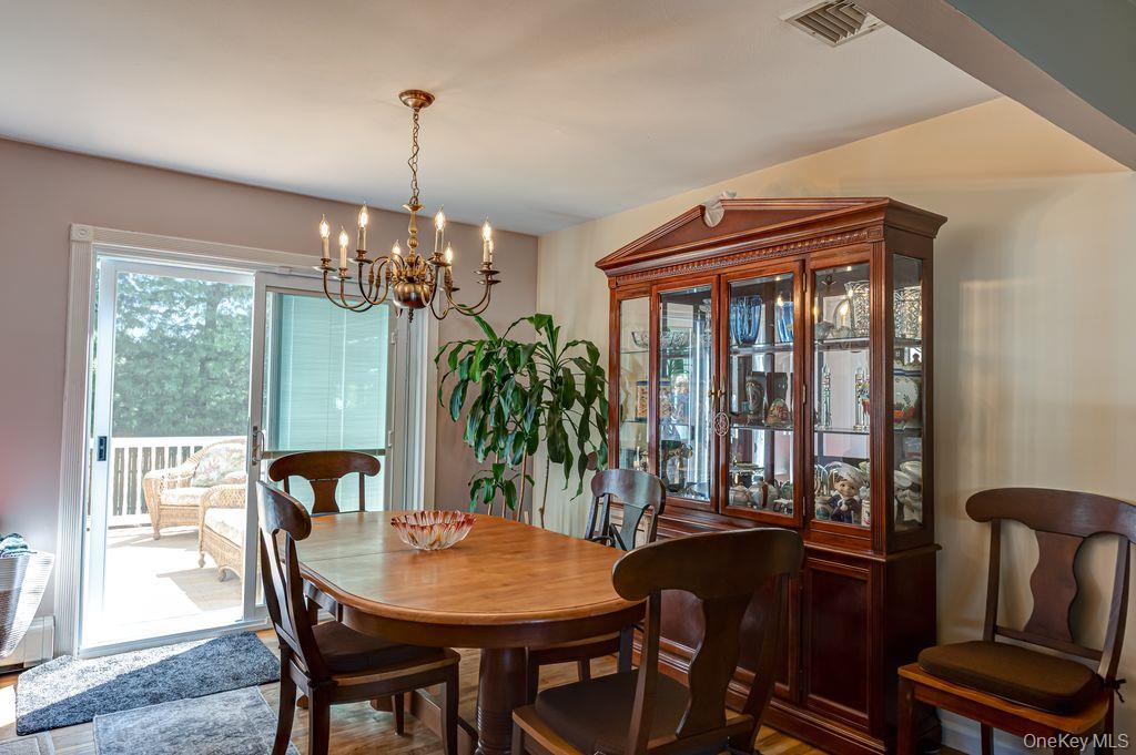 89 Cheltenham Road West Babylon, NY 11704 - Photo 9 of 26 a view of a dining room with furniture window and outside view