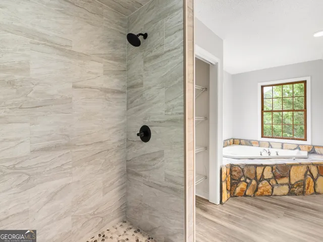 a view of a room with a ceiling fan