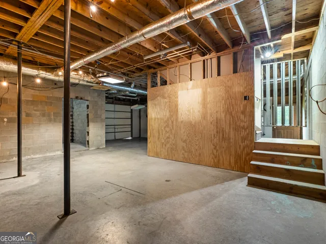 a view of a room with wooden walls