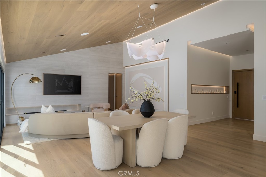 5826 Soledad Mountain Road La Jolla, CA 92037 - Photo 11 of 52 a living room with furniture and a flat screen tv