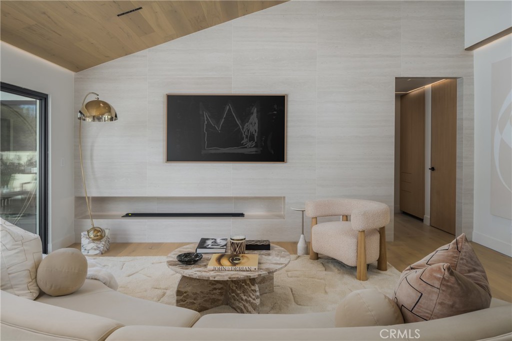 5826 Soledad Mountain Road La Jolla, CA 92037 - Photo 14 of 52 a living room with furniture and a mirror