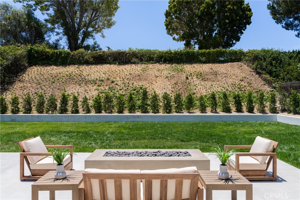 5826 Soledad Mountain Road La Jolla, CA 92037 - Photo 33 of 52 a view of a table and chairs on the yard