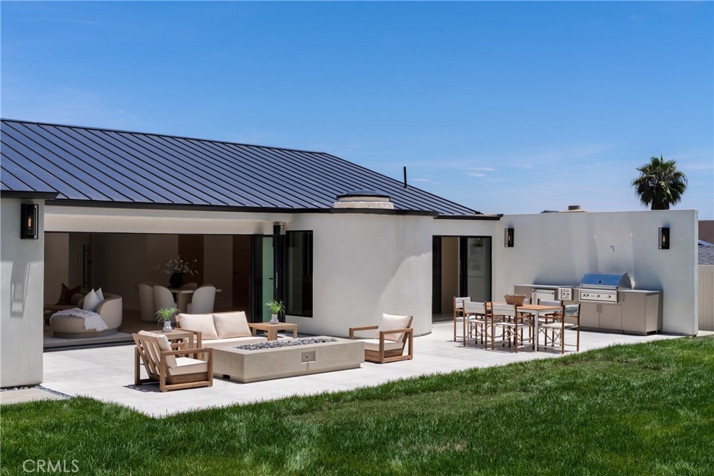5826 Soledad Mountain Road La Jolla, CA 92037 - Photo 34 of 52 a view of a house with backyard and sitting area