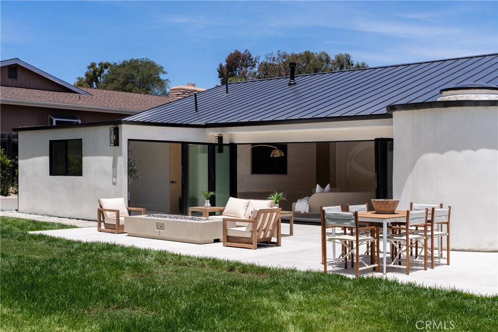 5826 Soledad Mountain Road La Jolla, CA 92037 - Photo 36 of 52 a view of an house with backyard porch and furniture