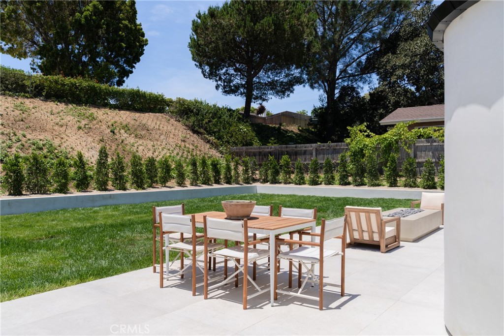 5826 Soledad Mountain Road La Jolla, CA 92037 - Photo 38 of 52 a patio with table and chairs