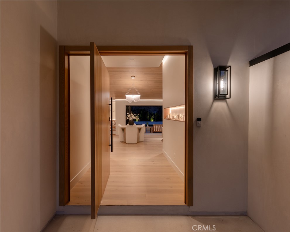 5826 Soledad Mountain Road La Jolla, CA 92037 - Photo 47 of 52 a view of a hallway and a livingroom with a chair