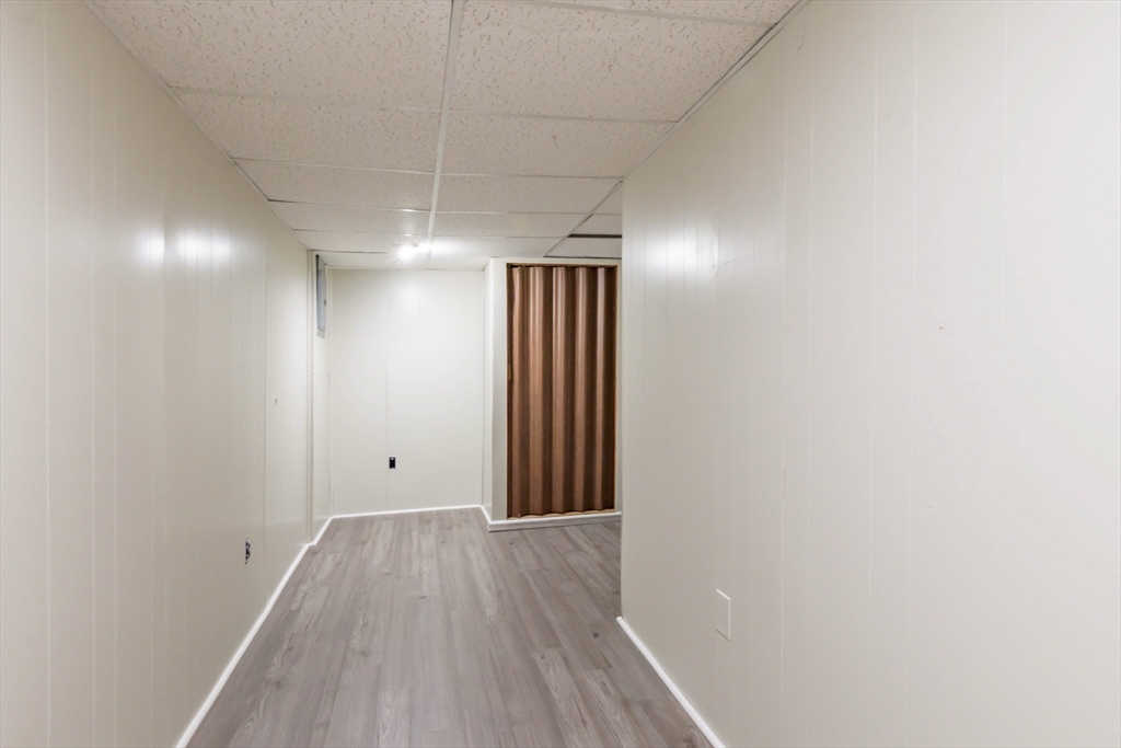 30 Lochmere Lane, Unit 30 Nashua, NH 03063 - Photo 15 of 19 a view of hallway with wooden floor