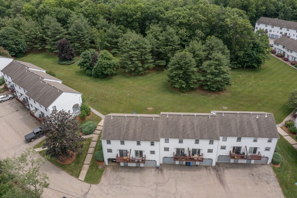 30 Lochmere Lane, Unit 30 Nashua, NH 03063 - Photo 17 of 19 an aerial view of a house with a garden