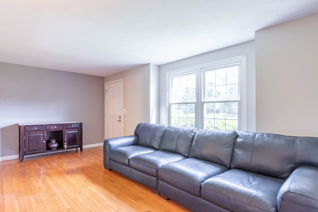 30 Lochmere Lane, Unit 30 Nashua, NH 03063 - Photo 2 of 19 a living room with furniture window and a couch