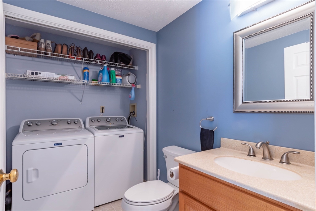 30 Lochmere Lane, Unit 30 Nashua, NH 03063 - Photo 4 of 19 a utility room with dryer and washer