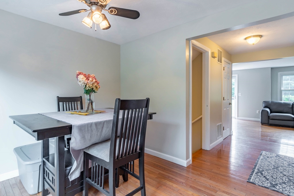 30 Lochmere Lane, Unit 30 Nashua, NH 03063 - Photo 5 of 19 a view of a dining room with furniture and wooden floor
