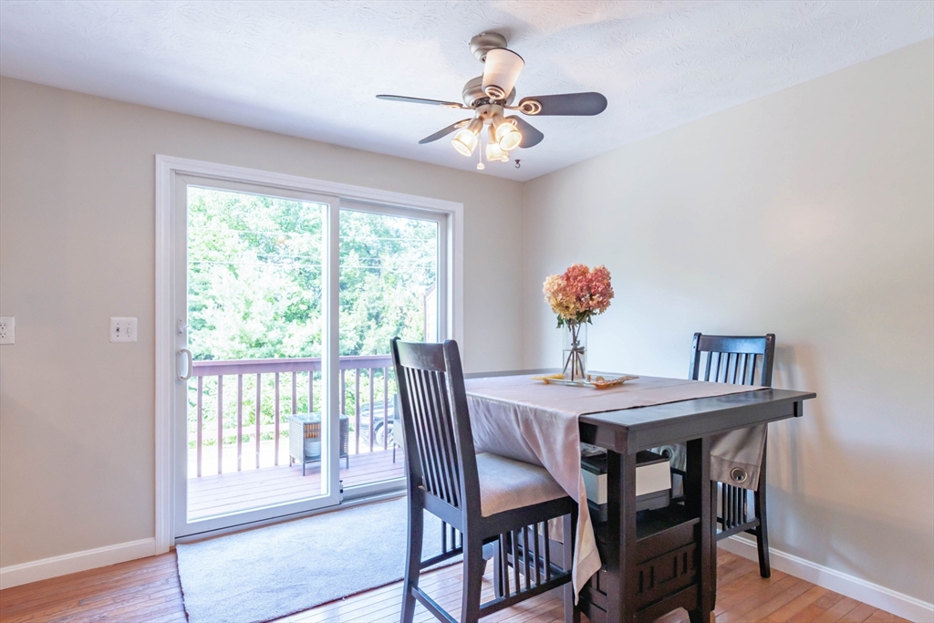 30 Lochmere Lane, Unit 30 Nashua, NH 03063 - Photo 6 of 19 a view of a dining room with furniture window and wooden floor