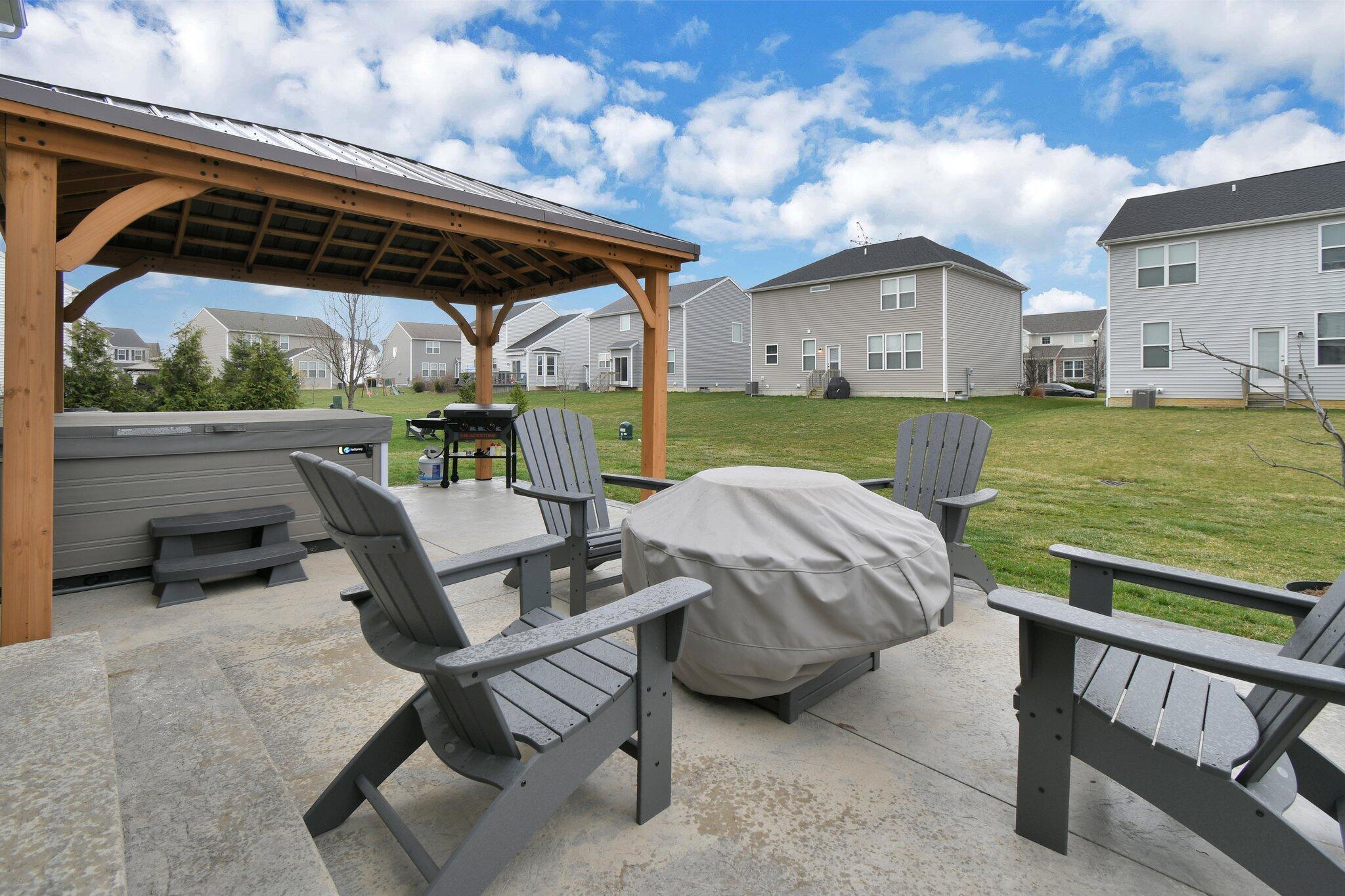 916 Rooks Circle Sunbury, OH 43074 - Photo 30 of 39 Upgraded patio with pergola overlooking the backyard!