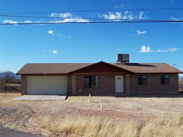 884 Elote Court, Unit CORTE Rio Rico, AZ 85648 - Photo 1 of 13 a house with a outdoor space