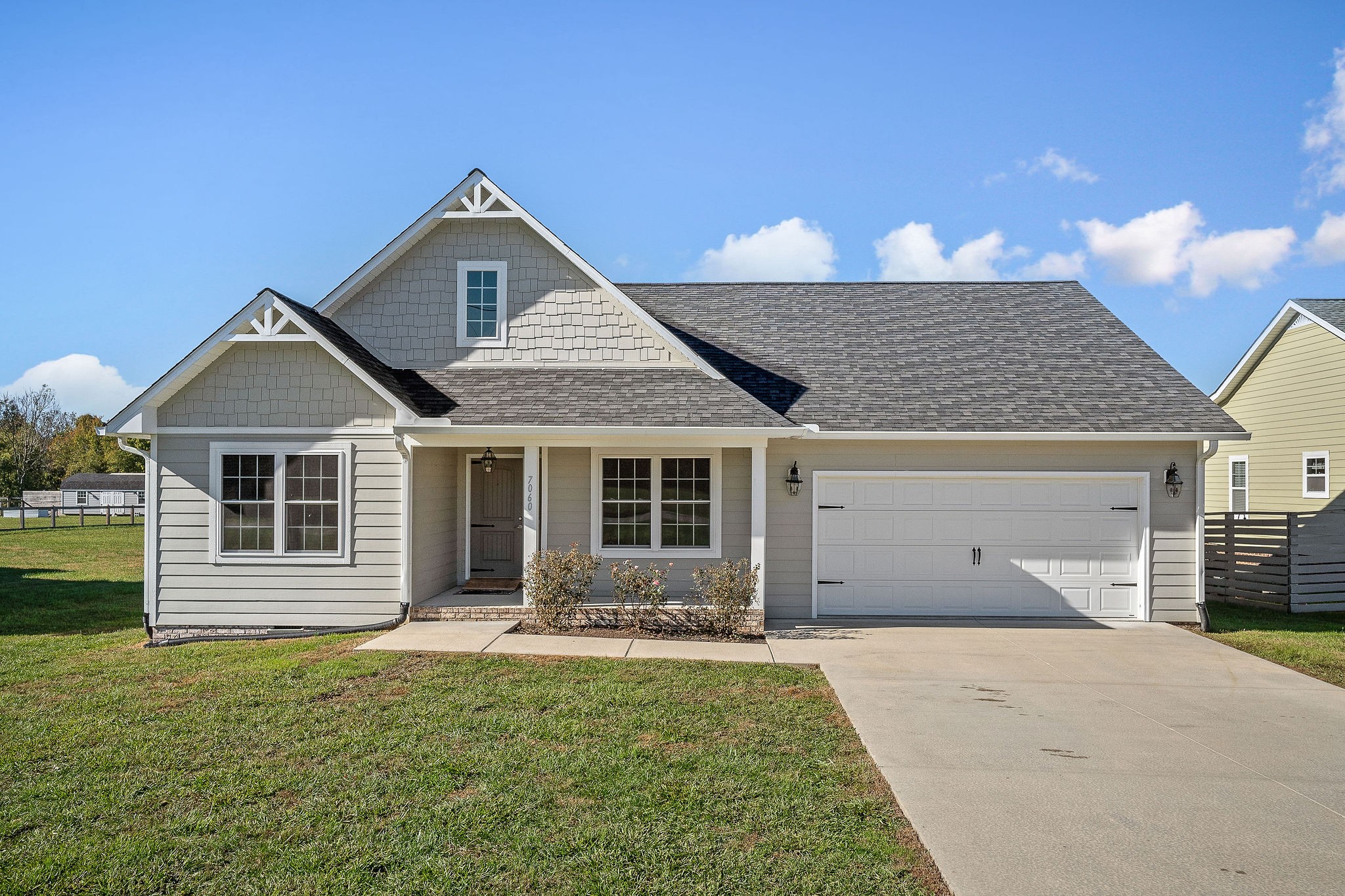 7060 Ditty Road Cookeville, TN 38506 - Photo 1 of 35 a front view of a house with a yard and garage