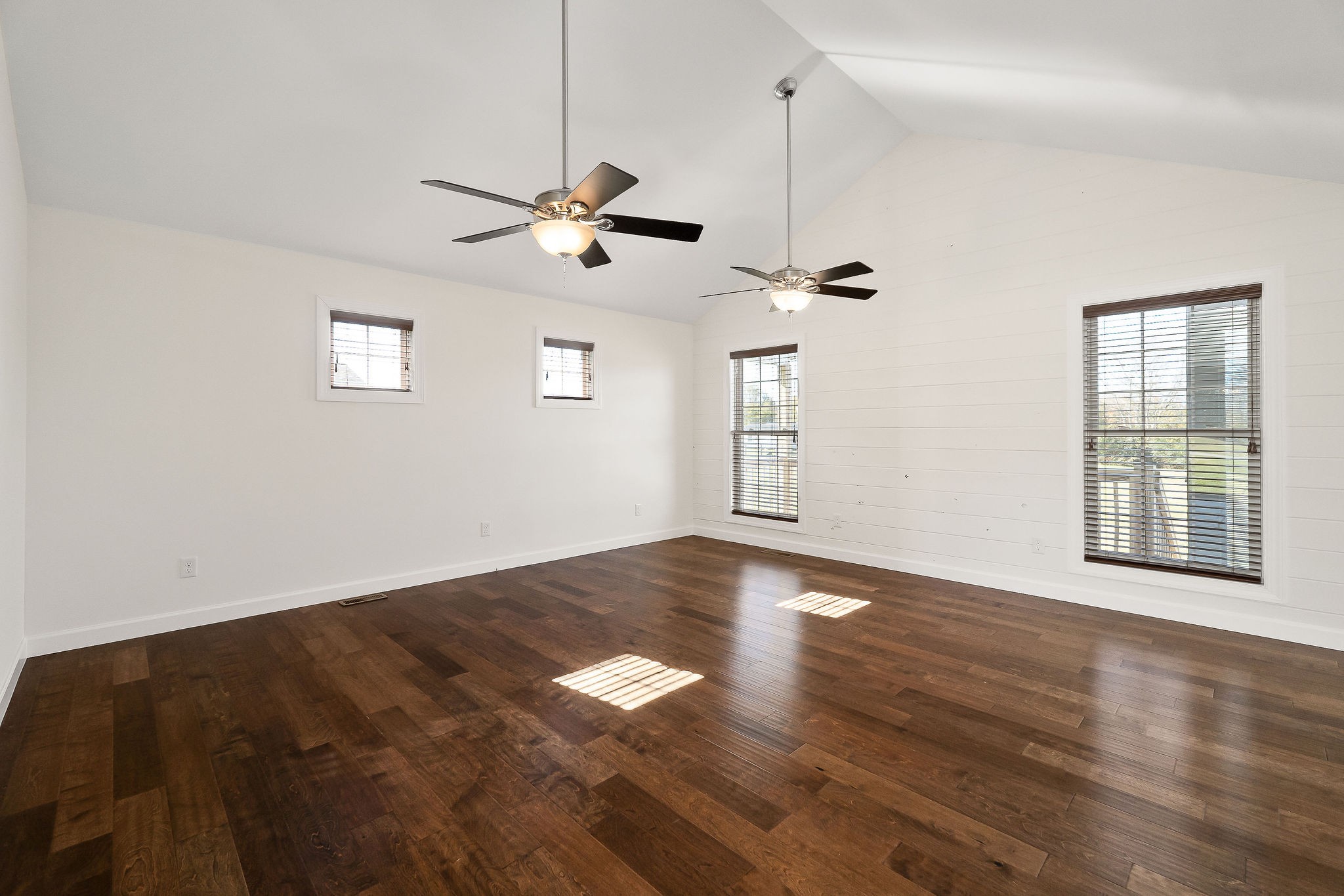 7060 Ditty Road Cookeville, TN 38506 - Photo 13 of 35 a view of an empty room with a window and wooden floor