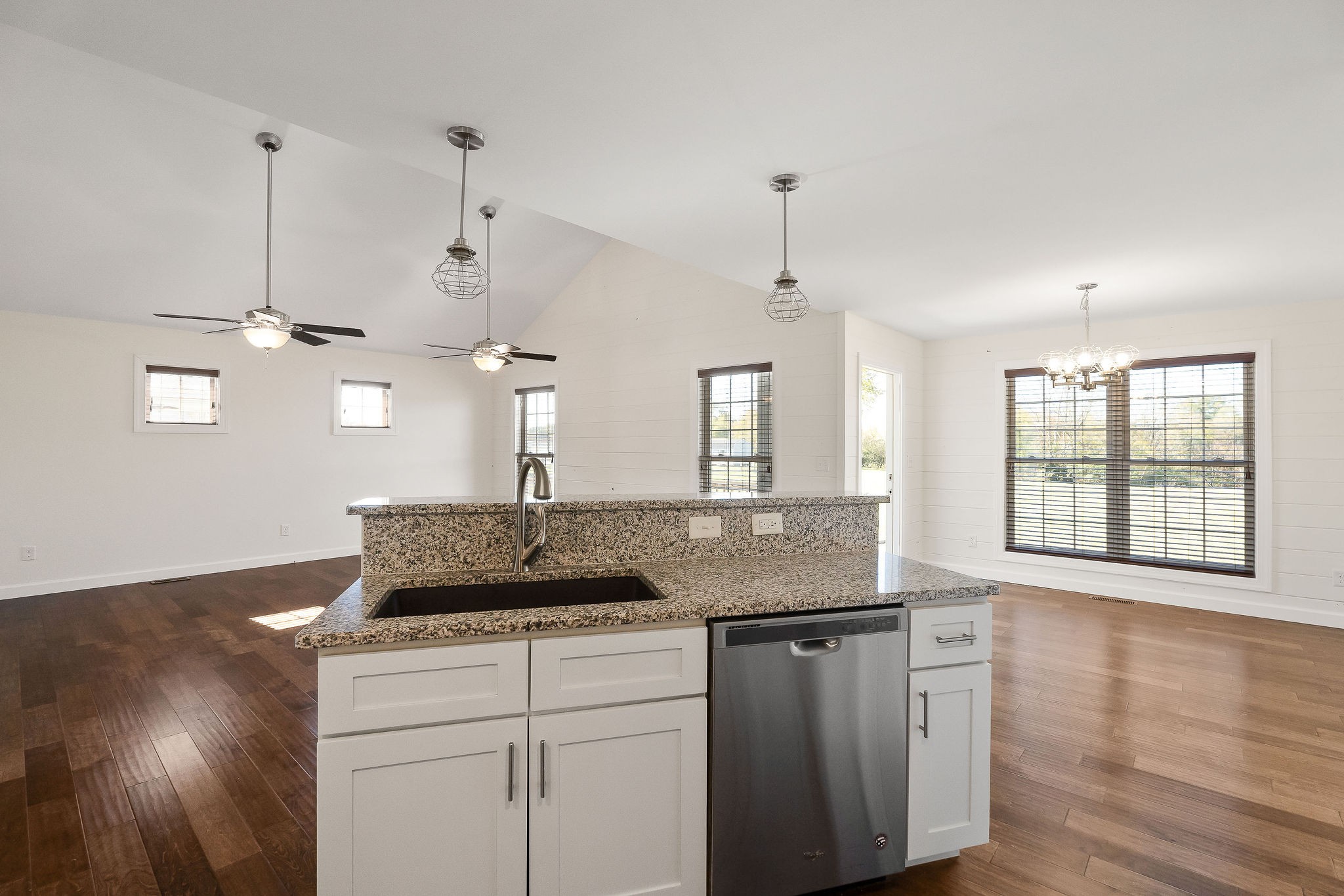 7060 Ditty Road Cookeville, TN 38506 - Photo 20 of 35 a kitchen with a sink a window and wooden floor