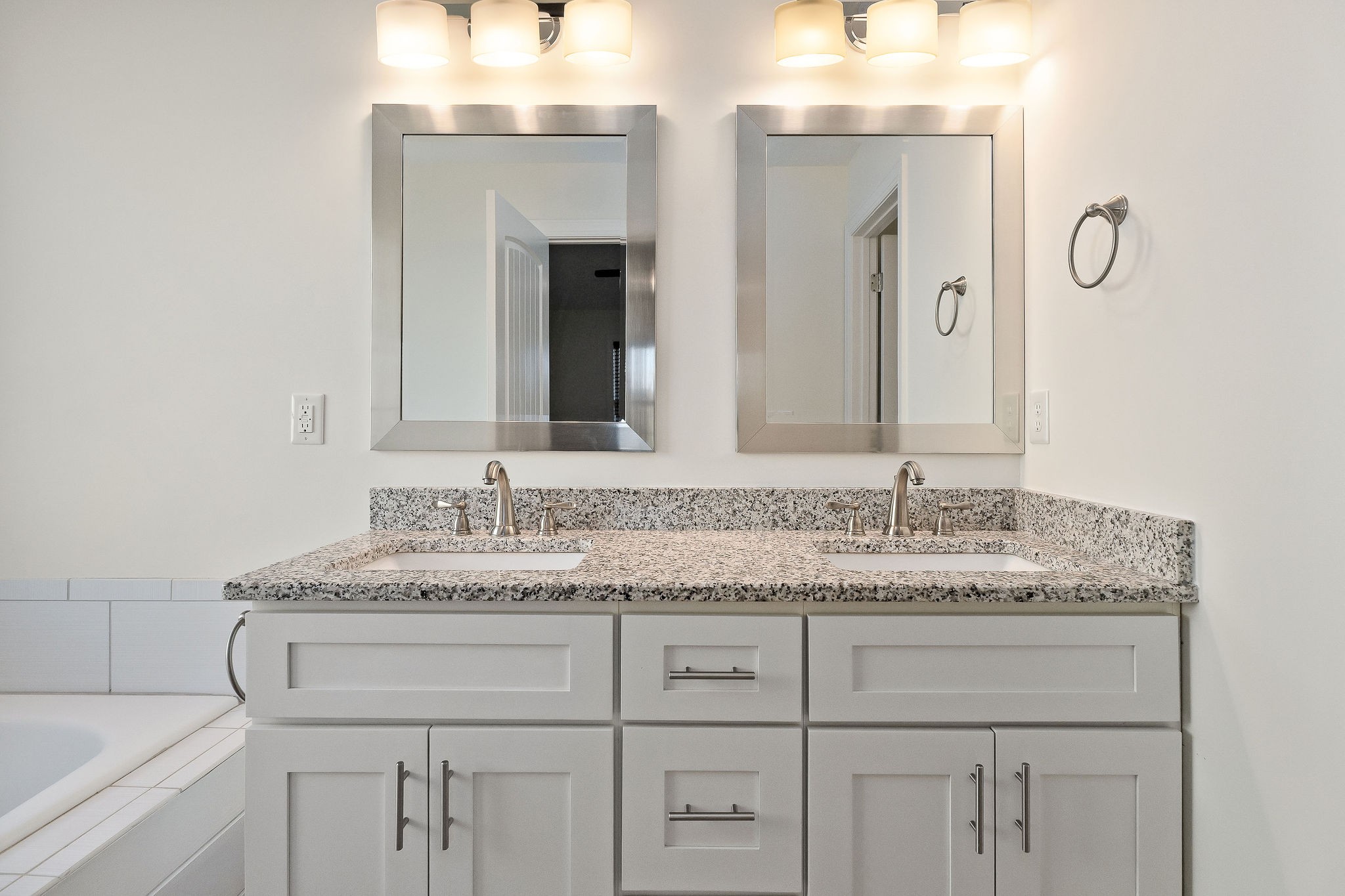 7060 Ditty Road Cookeville, TN 38506 - Photo 27 of 35 a bathroom with a granite countertop sink vanity and mirror