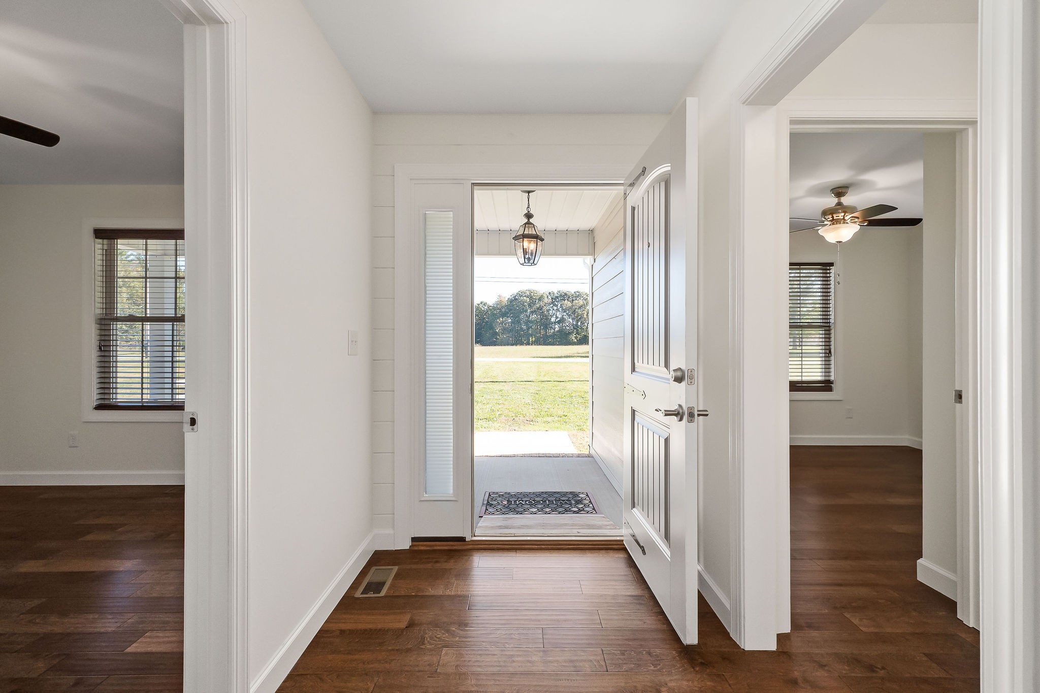 7060 Ditty Road Cookeville, TN 38506 - Photo 6 of 35 a view of a hallway with wooden floor and windows