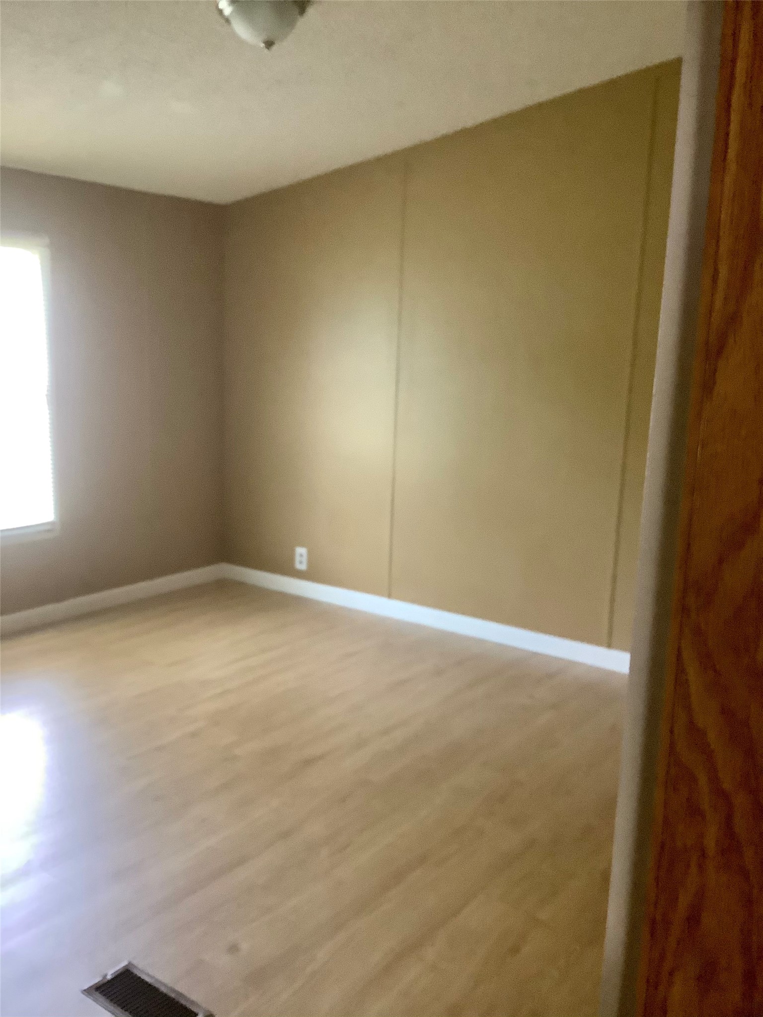 27199 Short Street Splendora, TX 77372 - Photo 16 of 18 an empty room with a empty space and a window