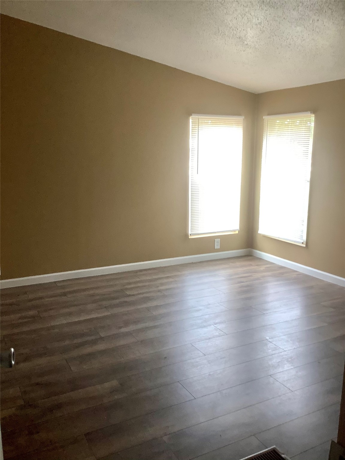 27199 Short Street Splendora, TX 77372 - Photo 18 of 18 a view of room with window and wooden floor