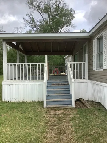a view of a house with a small yard