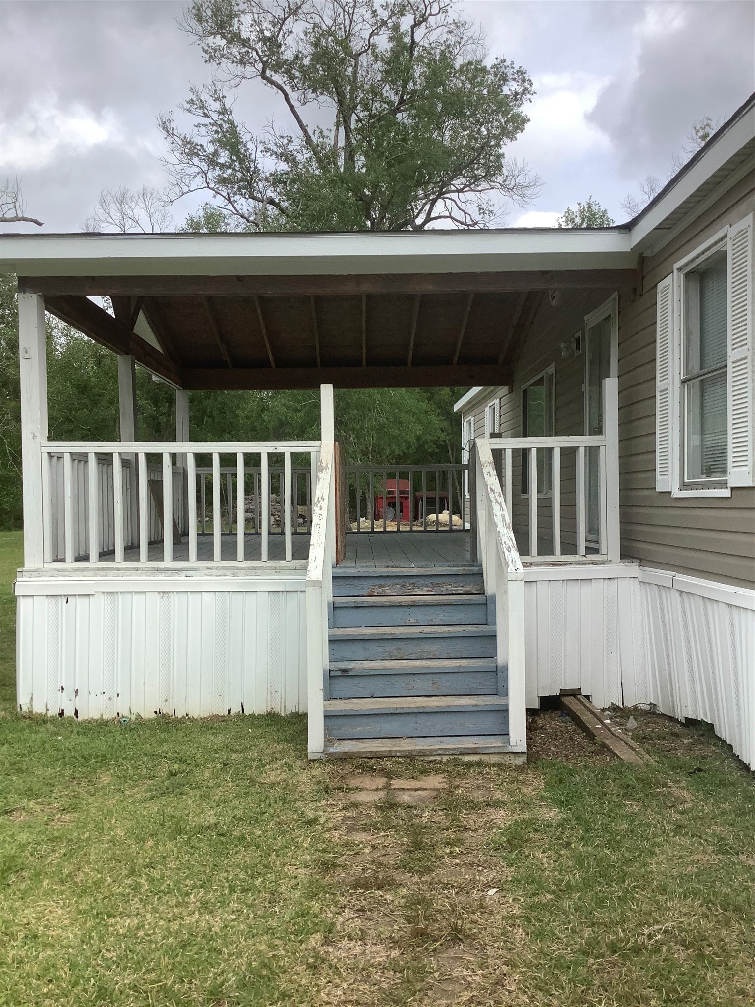 27199 Short Street Splendora, TX 77372 - Photo 2 of 18 a view of a house with a small yard