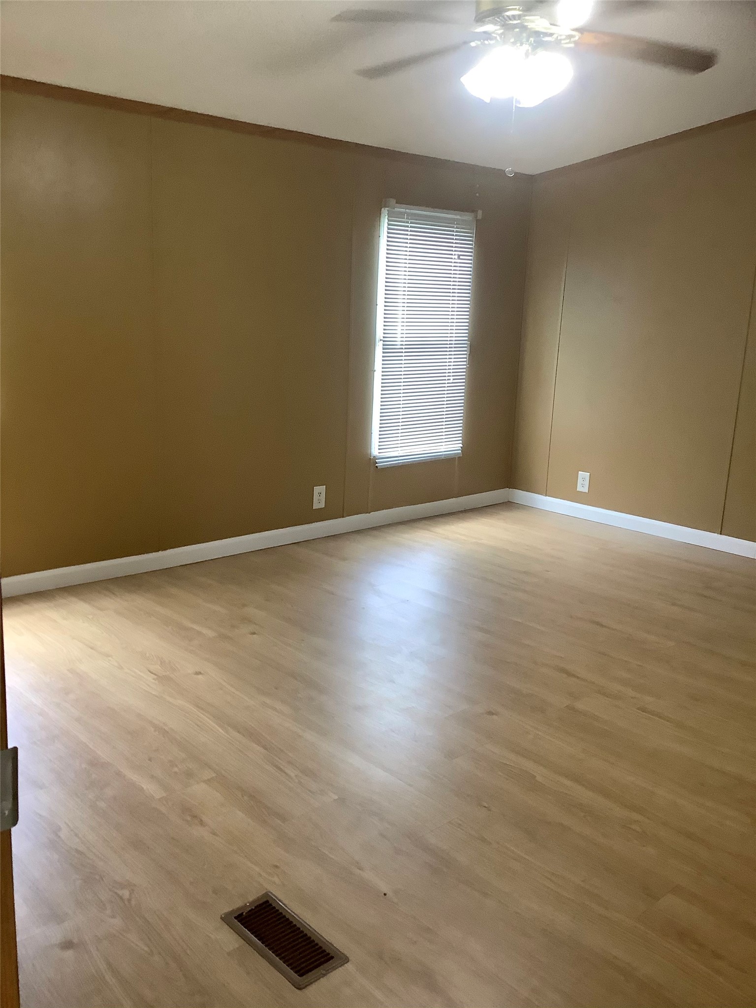 27199 Short Street Splendora, TX 77372 - Photo 10 of 18 an empty room with wooden floor and windows
