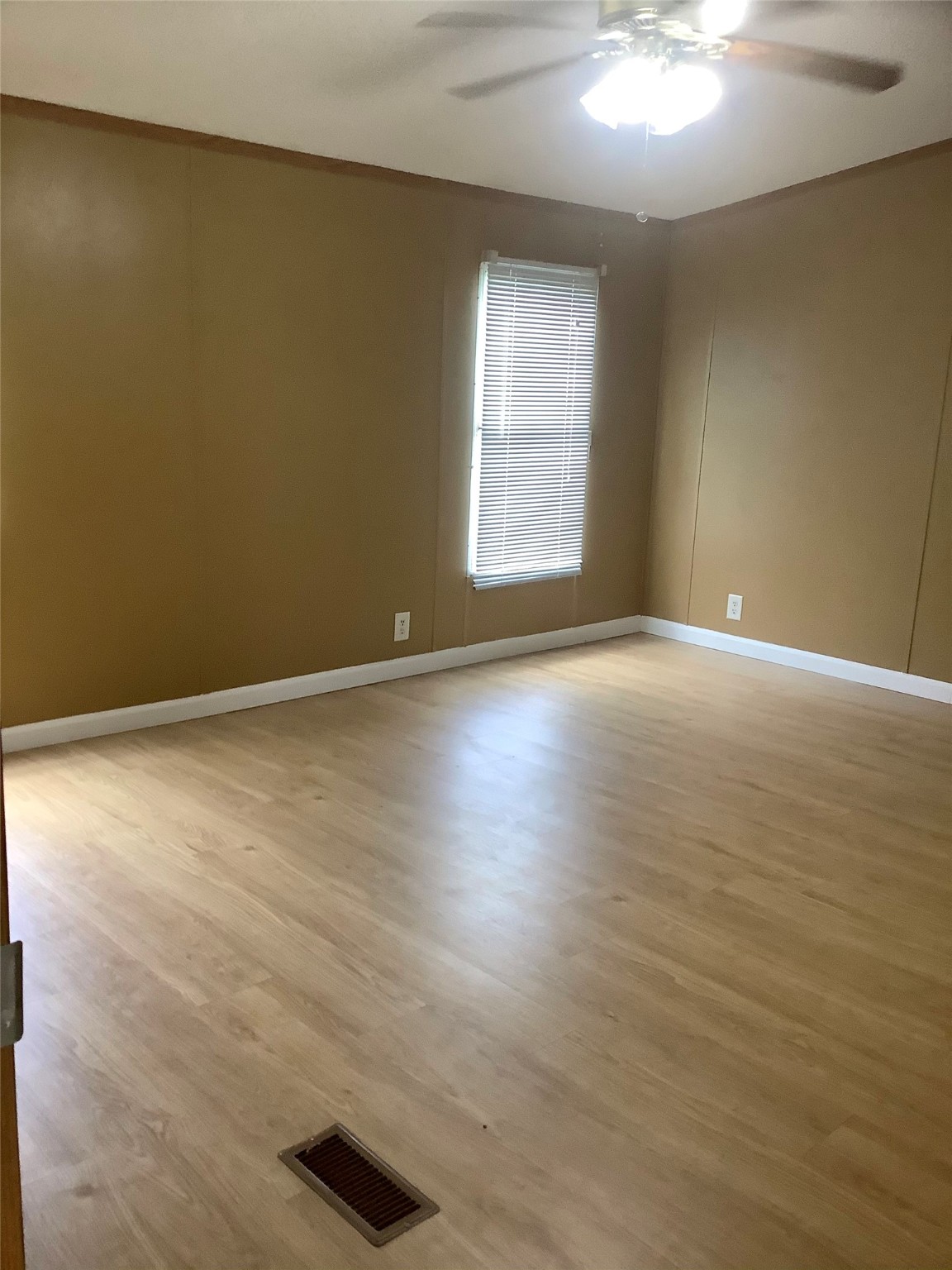 27199 Short Street Splendora, TX 77372 - Photo 10 of 18 an empty room with wooden floor and windows