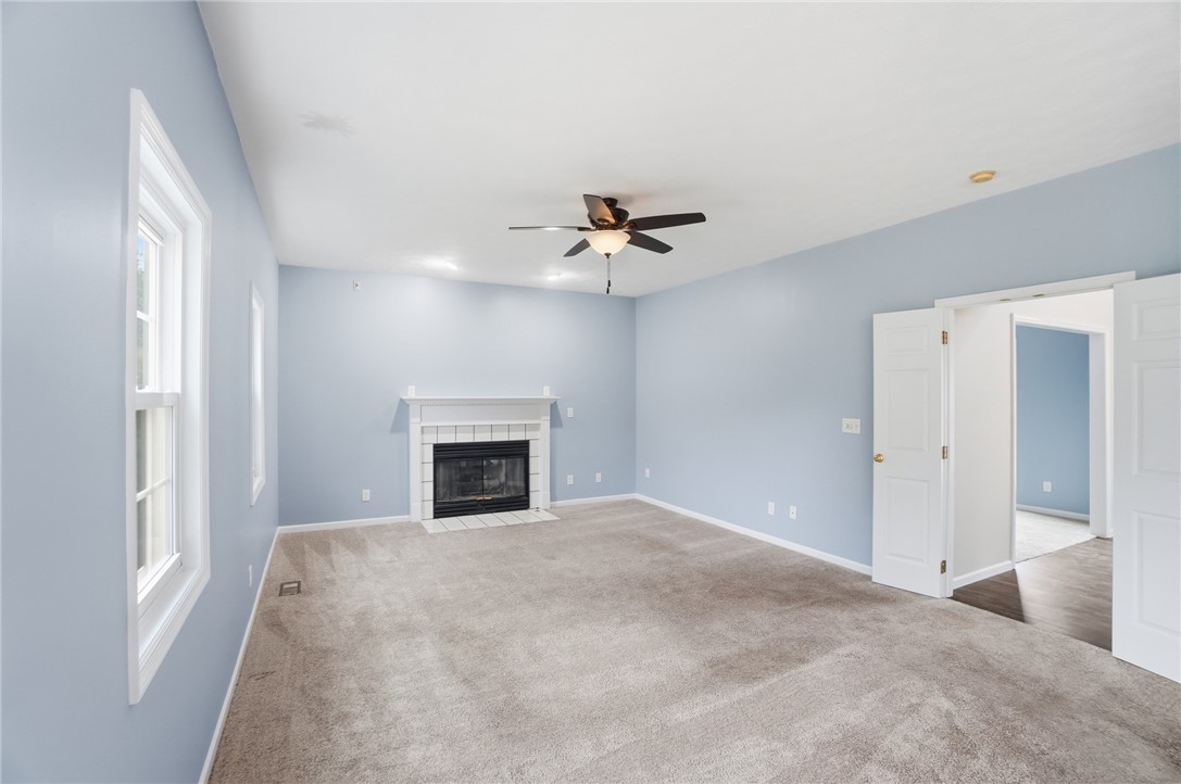 10 Chase Court Springboro, OH 45066 - Photo 13 of 75 This inviting living area features a cozy fireplace, perfect for creating cherished memories.