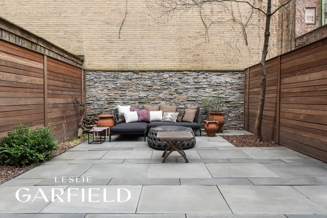 a view of a chairs and table in the balcony