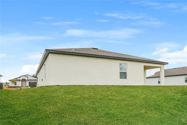 a view of a backyard of the house