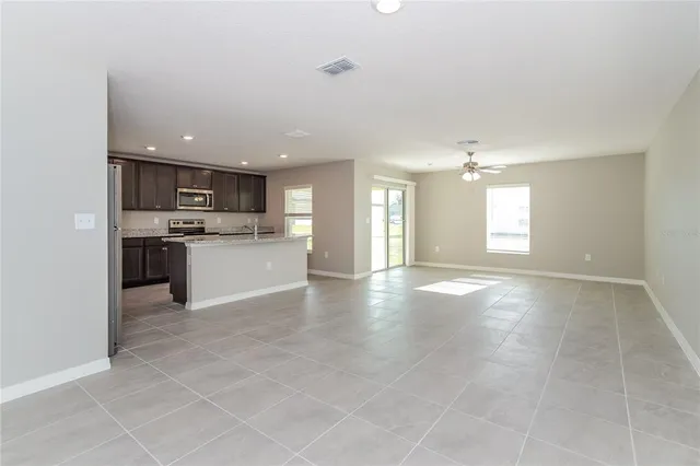 a view of a kitchen with a sink and a microwave