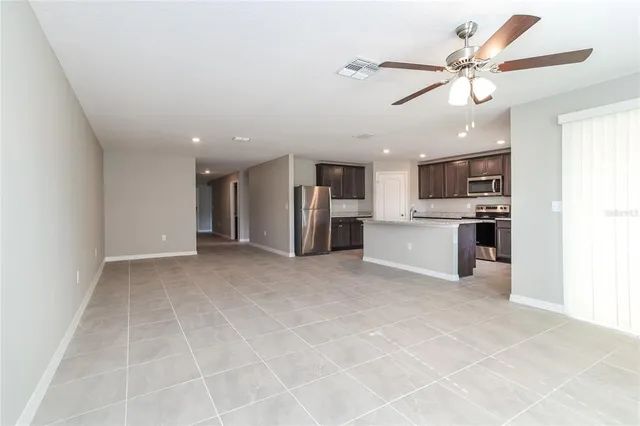 a view of a kitchen with a sink and a window