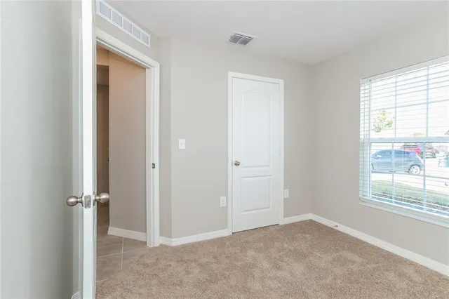 an empty room that has a window