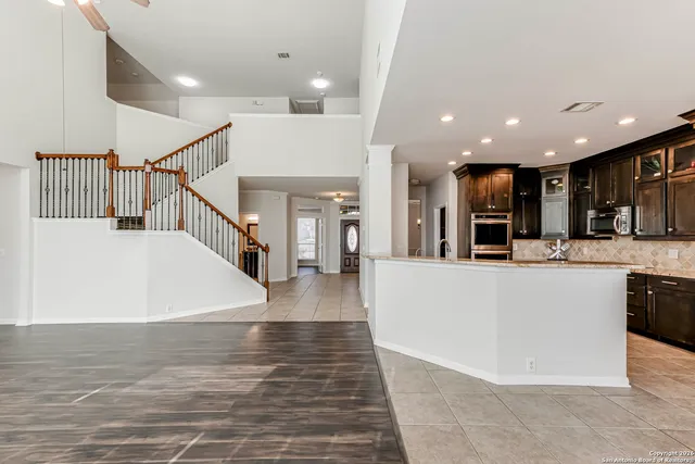 a view of kitchen with furniture and wooden floor