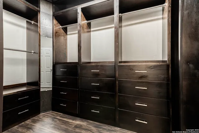 a room with a black cabinets and a dresser