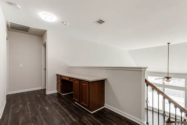 a kitchen with a sink and a refrigerator