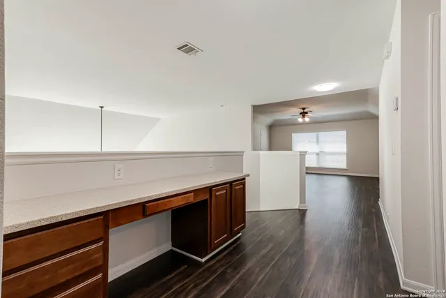 a view of a kitchen with a sink and a stove