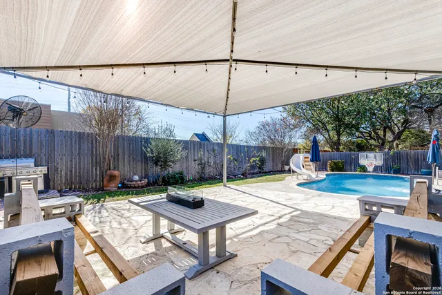 a view of a backyard with a patio