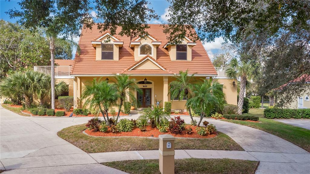 7655 Debeaubien Drive Orlando, FL 32835 - Photo 1 of 1 front view of a house with a yard