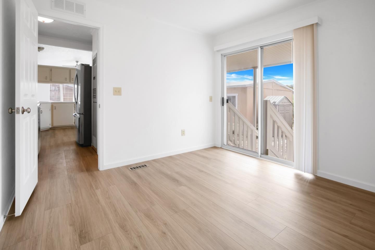 4300 Soquel Drive, Unit 15 Soquel, CA 95073 - Photo 12 of 15 an empty room with wooden floor and a bathroom