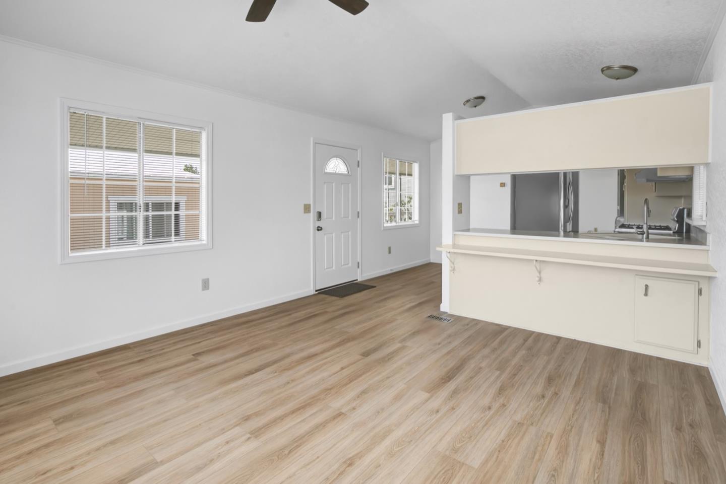 4300 Soquel Drive, Unit 15 Soquel, CA 95073 - Photo 4 of 15 a view of a kitchen with wooden floor and electronic appliances