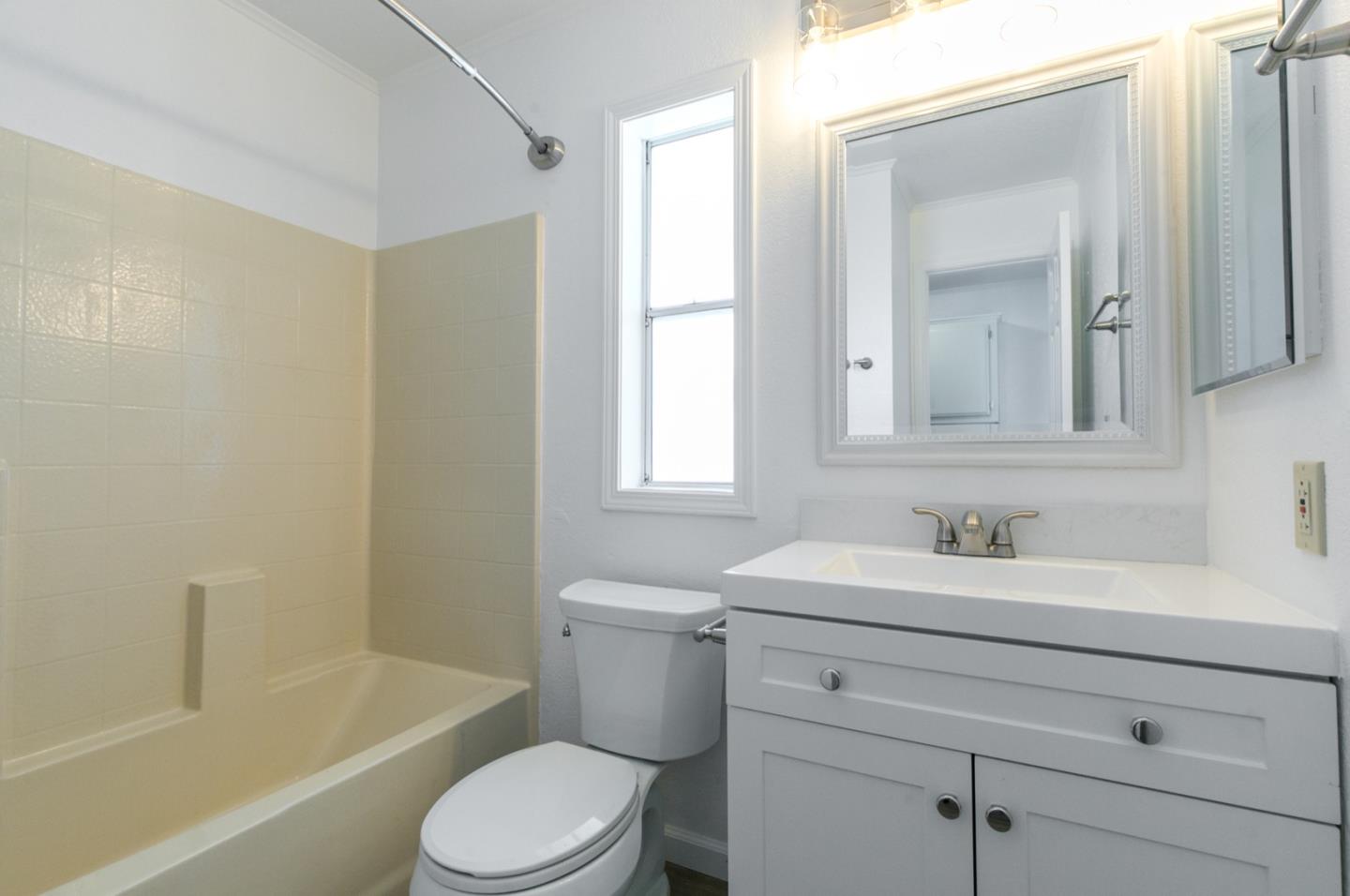 4300 Soquel Drive, Unit 15 Soquel, CA 95073 - Photo 10 of 15 a bathroom with a sink toilet vanity and tub