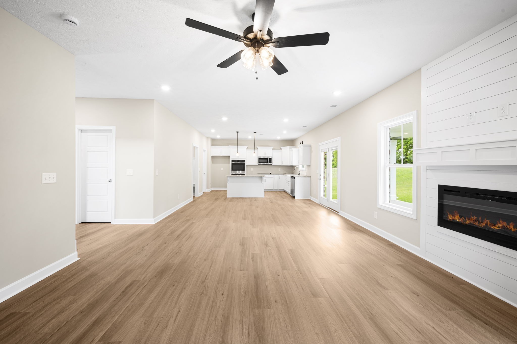 439 Blue Ridge Clarksville, TN 37043 - Photo 12 of 47 a view of a livingroom with a fireplace a ceiling fan and wooden floor