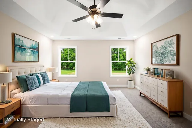 a bedroom with a large bed and a window