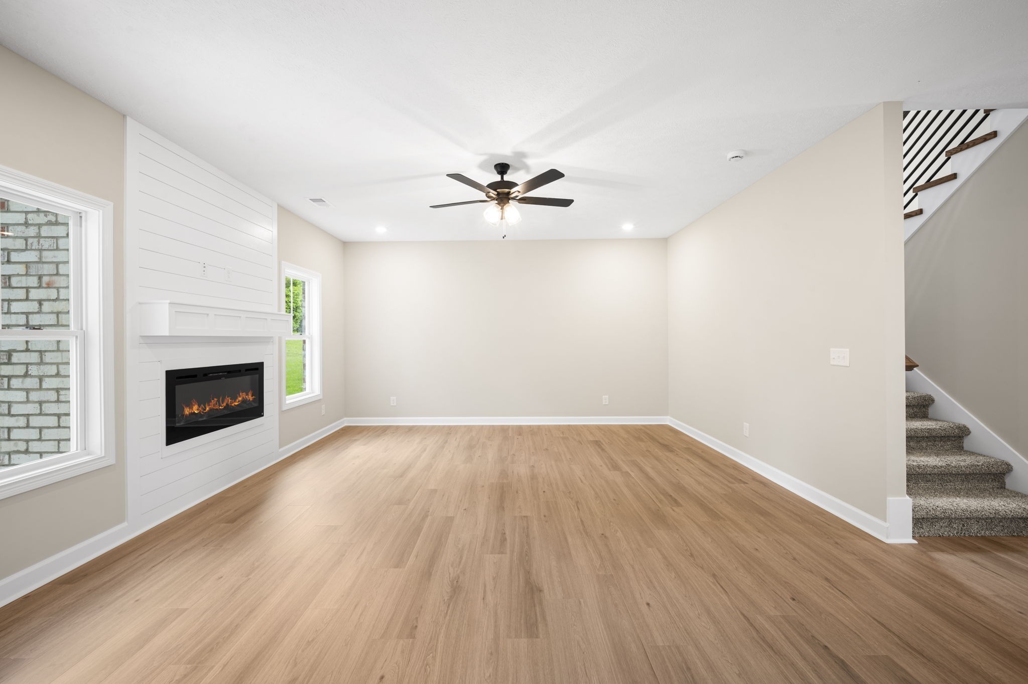 439 Blue Ridge Clarksville, TN 37043 - Photo 8 of 47 wooden floor in an empty room with a fireplace and a chandelier